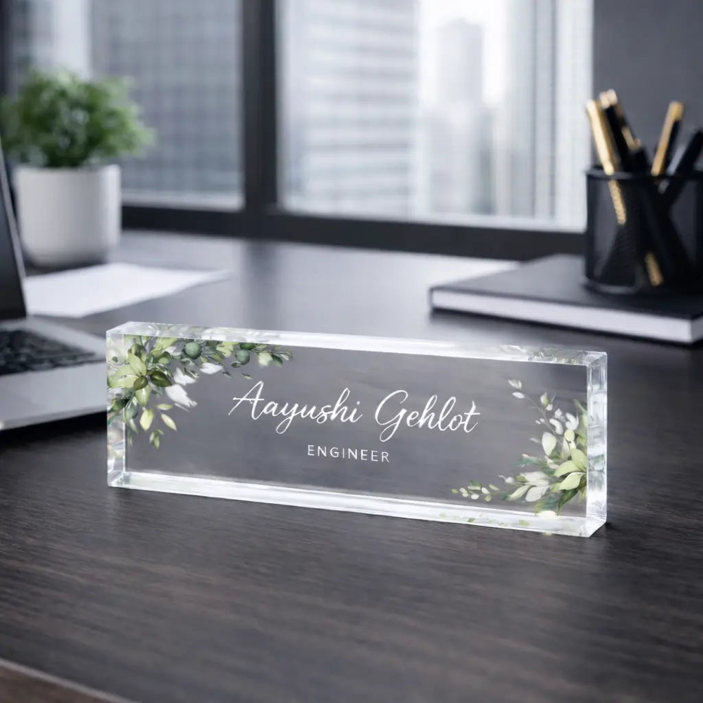 Personalized acrylic desk nameplate with custom name and designation on a professional office desk