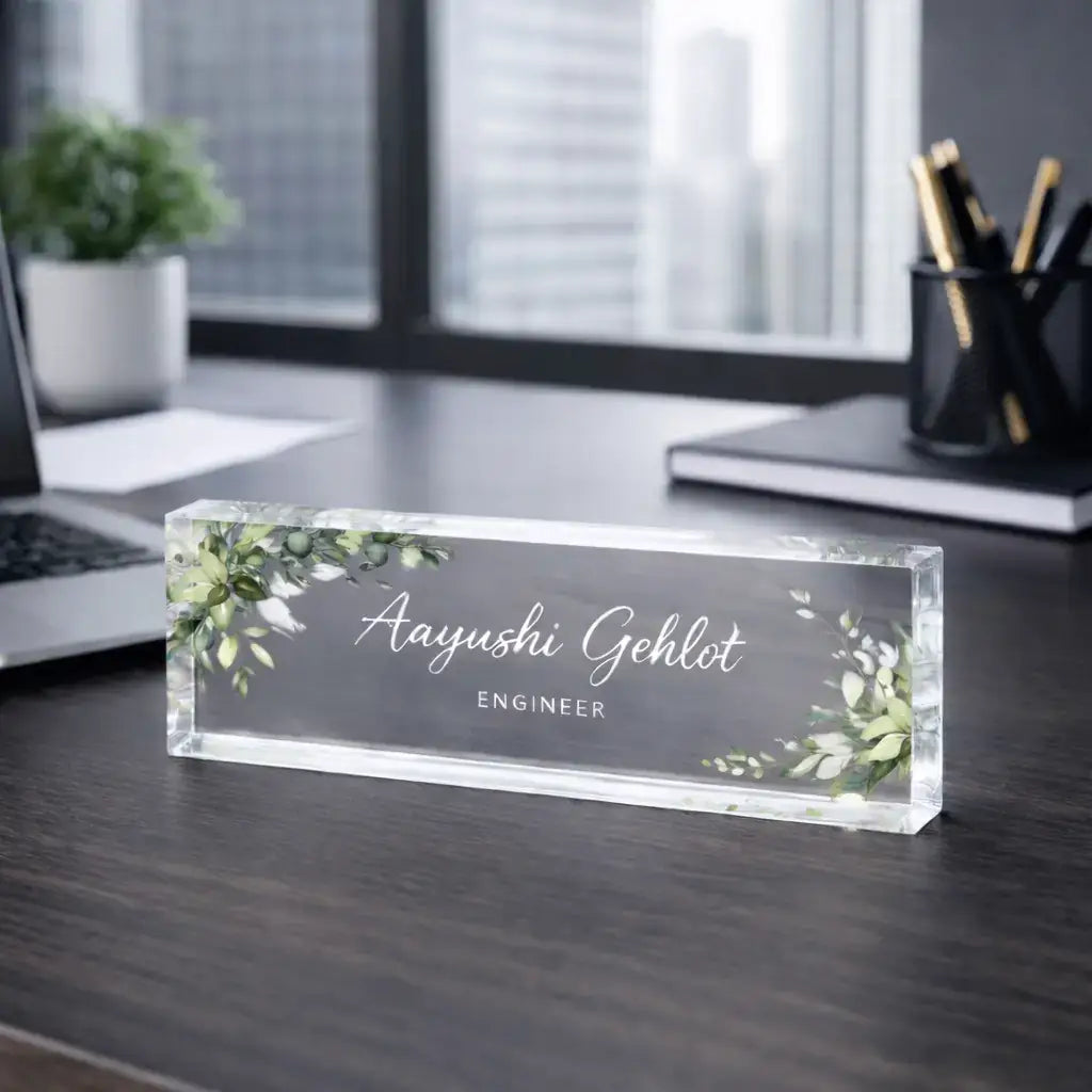 Personalized acrylic desk nameplate with custom name and designation on a professional office desk