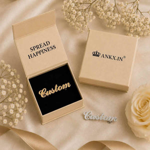 Gold custom name brooch for men displayed inside a premium ANKX gift box, alongside a silver personalized lapel pin.