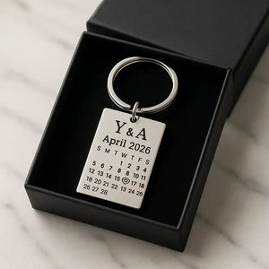 Custom date keychain with engraved calendar placed inside a black gift box
