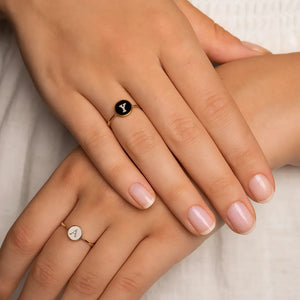 Gold and silver Custom Alphabet Rings with letters A and Y worn together.