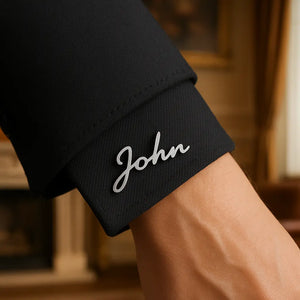 Personalized Name Cuff Brooch spelling Ankx on a burgundy suit cuff.