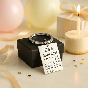 Personalized anniversary date keychain displayed with balloons and gifts