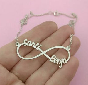 Silver infinity couple custom name necklace pendant with names Santi and Benja on a delicate chain