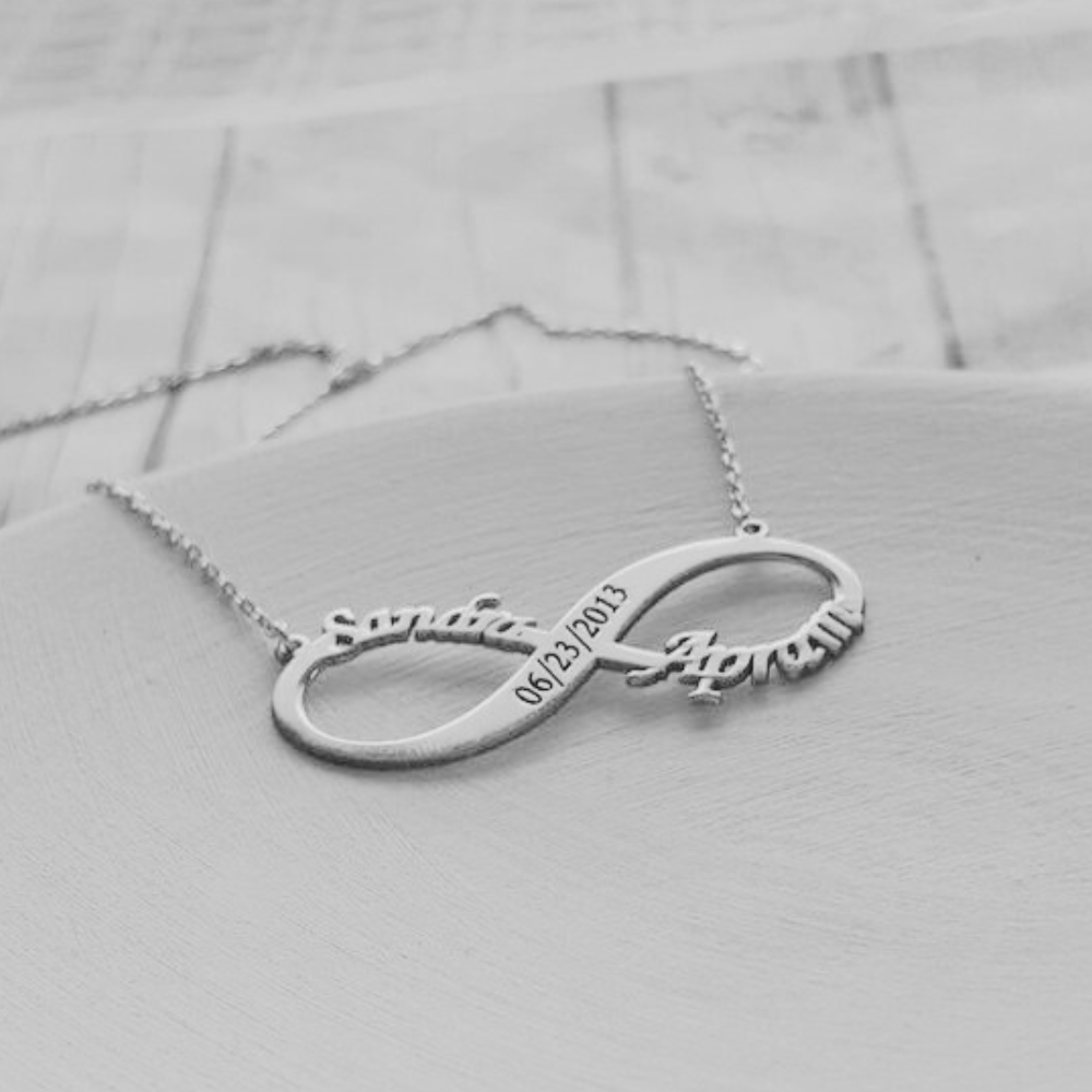 Silver infinity couple name necklace with date engraved on a delicate chain by Ankx.in
