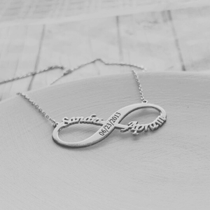 Silver infinity couple name necklace with date engraved on a delicate chain by Ankx.in