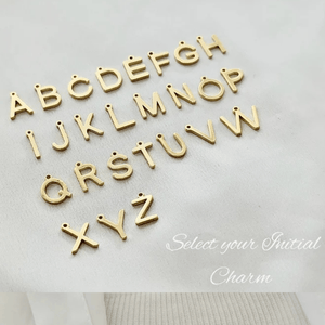 Gold alphabet charms for custom necklaces featuring an evil eye pendant option for personalization