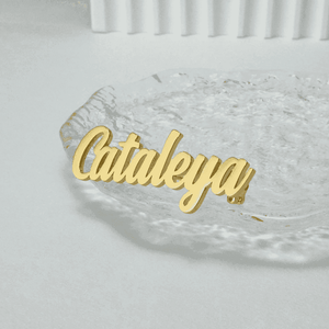 Personalized name lapel pin in gold showcasing elegant cursive design for unique style