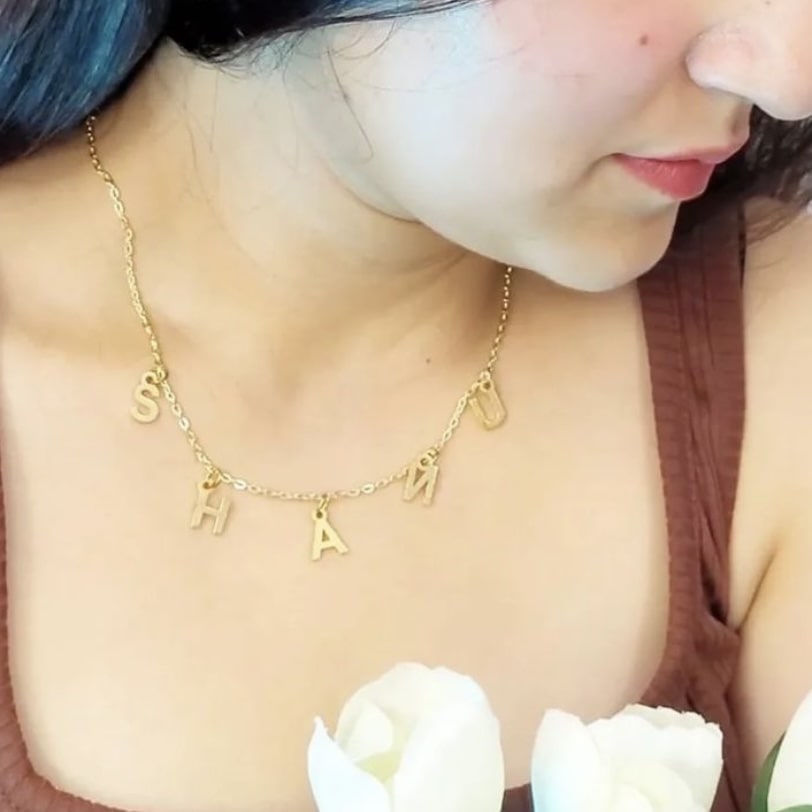 Ankx.in gold Name Necklace Letters Choker with individual letter pendants worn by woman