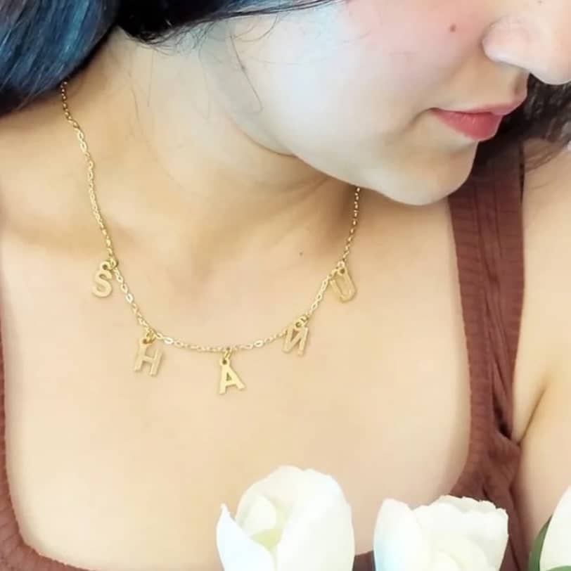 Ankx.in gold Name Necklace Letters Choker with individual letter pendants worn by woman