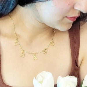 Ankx.in gold Name Necklace Letters Choker with individual letter pendants worn by woman