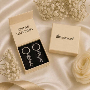 Ankx.in Name Keychain in a gift box with floral accents and a message to spread happiness