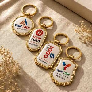 Four Custom Logo Keychains in Gold Finish with Personalization Options for Branding and Promotion