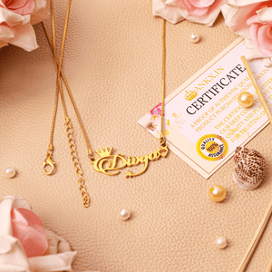 Custom name necklace with crown designed by Ankx.in featuring a delicate gold chain and personalized charm