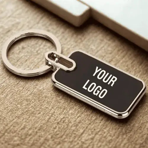 Silver keychain with black customizable logo tag.