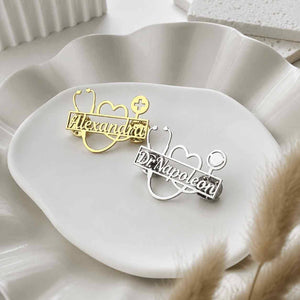 Doctor brooch with name in gold and silver on decorative shell plate