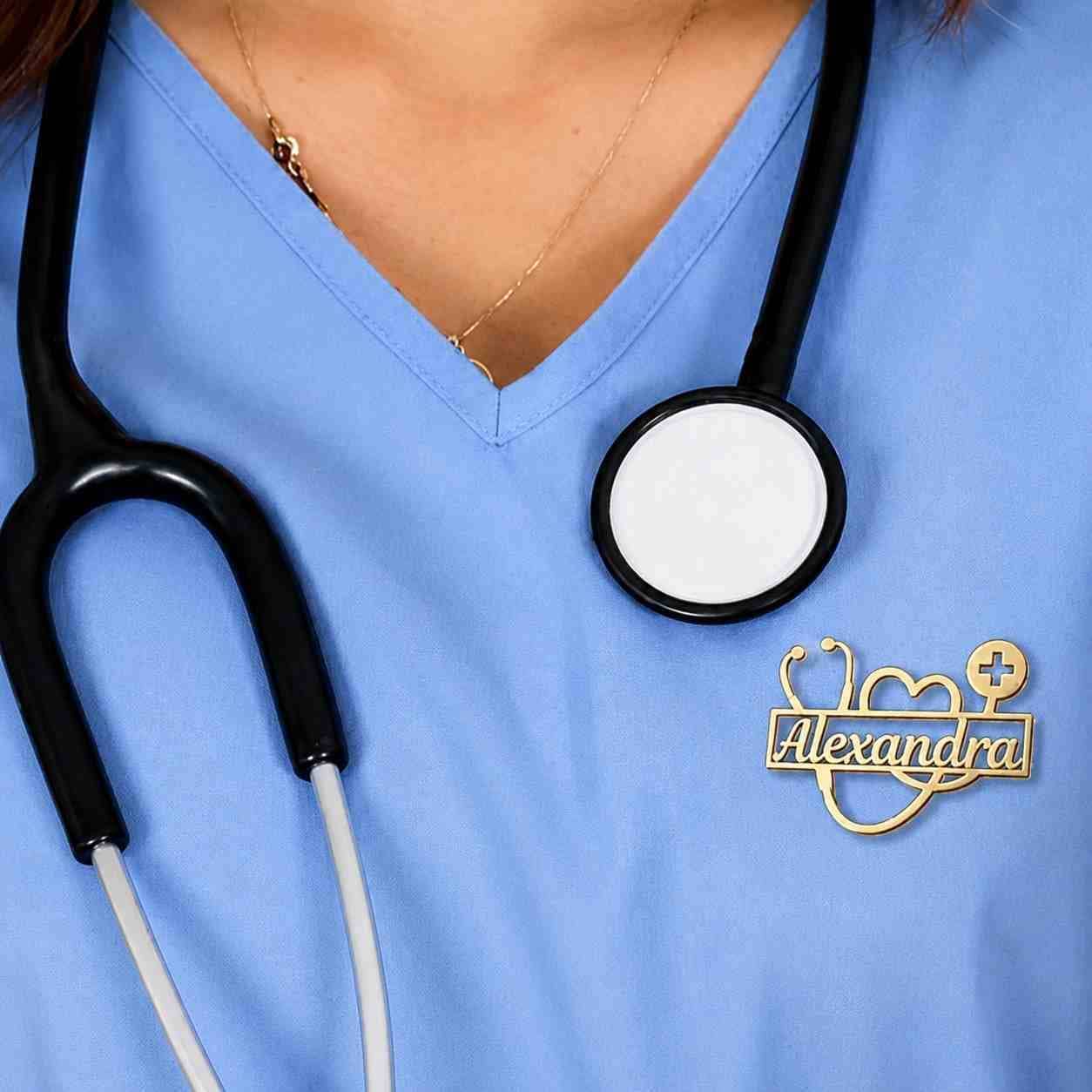 Personalized doctor brooch with name worn on blue medical scrubs