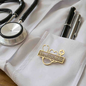 Personalized doctor brooch with name pinned on white coat pocket