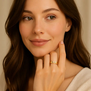 Woman wearing gold Arabic name ring, close-up hand pose