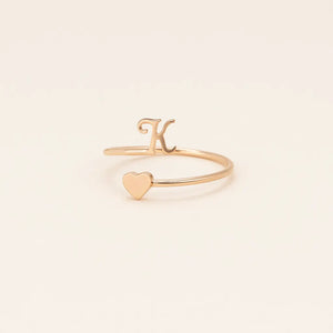 Minimalist gold Initial Heart Ring product close-up.