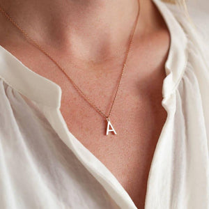 Ankx.in rose gold Initial Letter Necklace Alphabet pendant with letter A worn with a white blouse