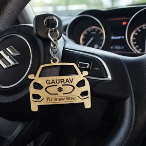 Ankx.in Maruti Swift Keychain in wooden design hanging from a car key near an ignition panel
