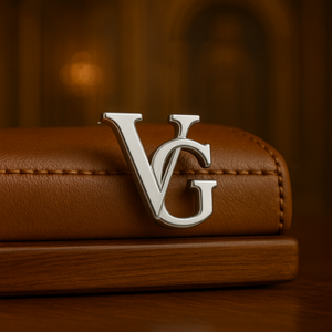 Elegant silver name brooch for men featuring the initials VG on a stylish leather background