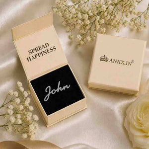 Name cuff brooch spelling John in Ankx gift box packaging with flowers