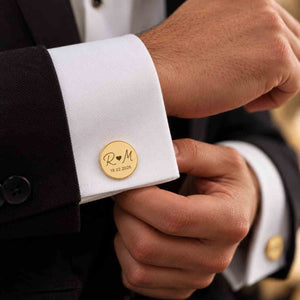 Personalized gold initial cufflinks with couple initials and wedding date on groom's shirt cuff