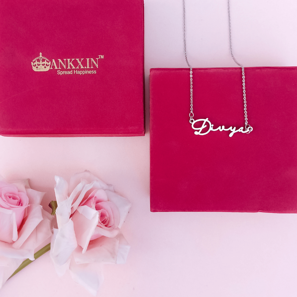 Personalized name necklace combo displayed with a gift box and roses for a special occasion