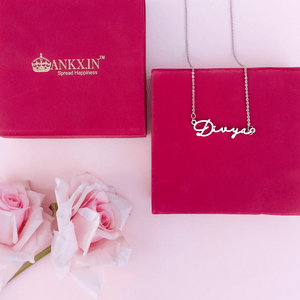 Personalized name necklace combo displayed with a gift box and roses for a special occasion