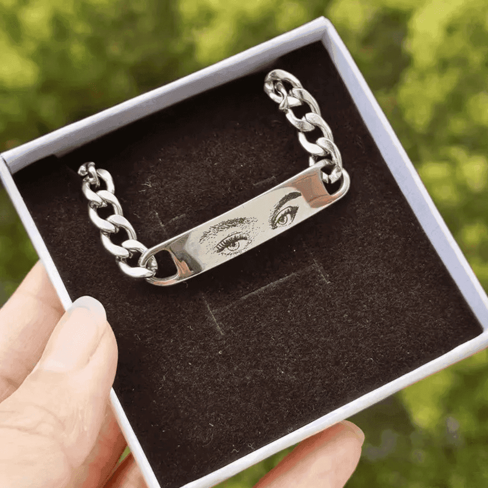 photo bracelet with engraved eyes held in hand silver plated