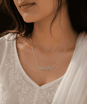 Punjabi Name Necklace in Silver with Intricate Lettering Worn by a Model