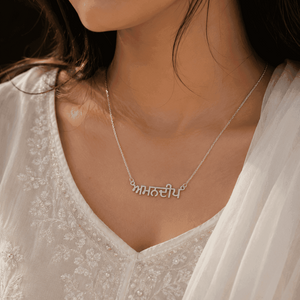 Punjabi Name Necklace in Silver with Intricate Lettering Worn by a Model