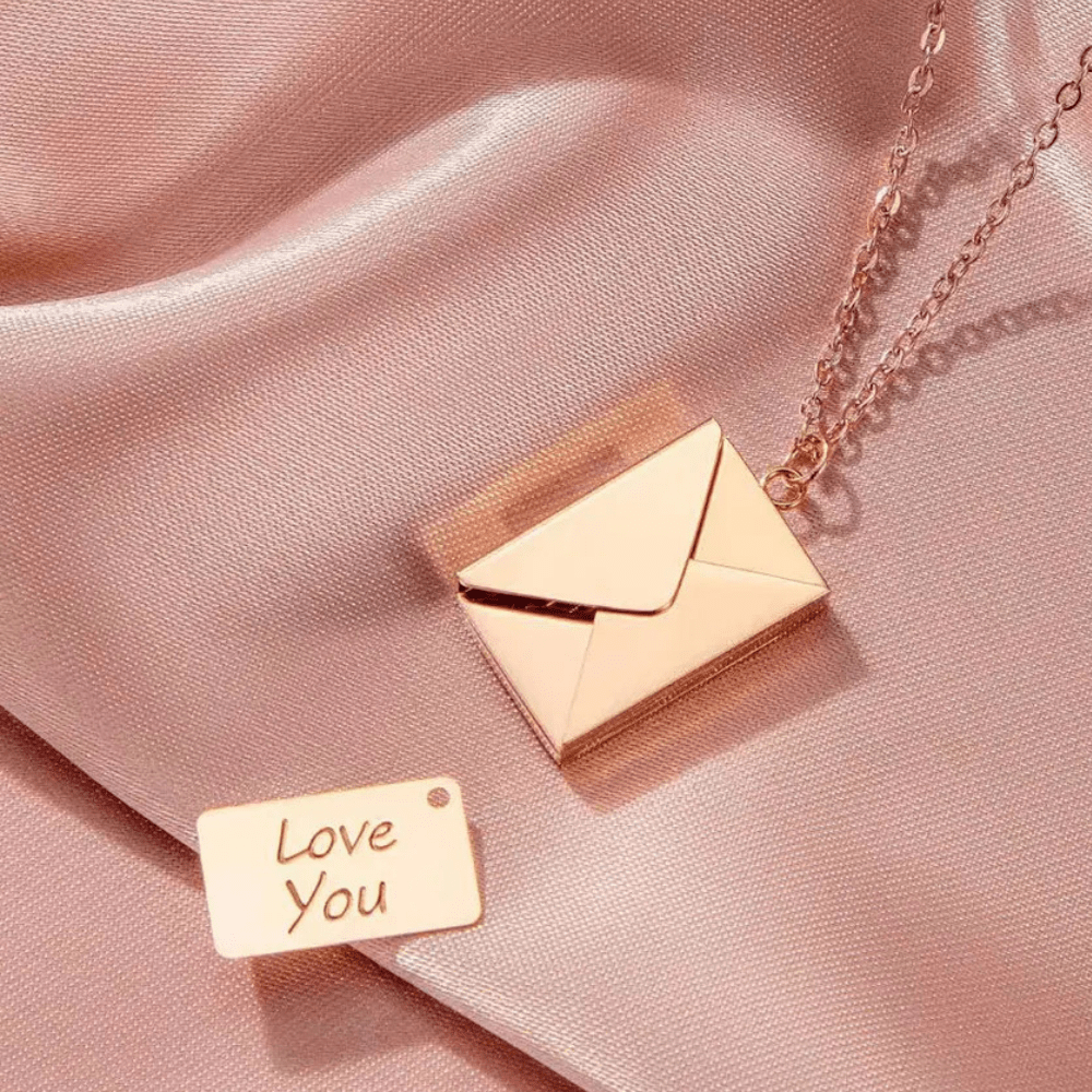 Ankx.in Secret Message Letter Envelope Necklace in rose gold with a small love you note pendant on silky fabric