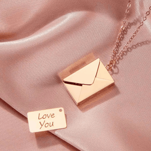 Ankx.in Secret Message Letter Envelope Necklace in rose gold with a small love you note pendant on silky fabric