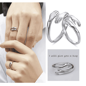 Stylish Silver hug ring featuring two hands in a loving embrace for a unique accessory