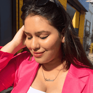 Woman wearing a Simple Name Necklace with the name Sabina in gold tone by Ankx.in