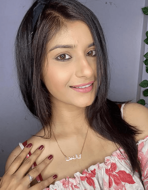 Woman wearing a custom name necklace showcasing stylish Custom Name Bracelets & Name Necklaces collection