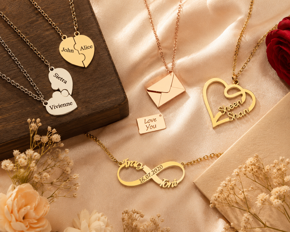 Personalized couple name necklaces including gold infinity pendant with date, heart puzzle name necklace, secret message envelope necklace, and gold heart name pendant from AKNX