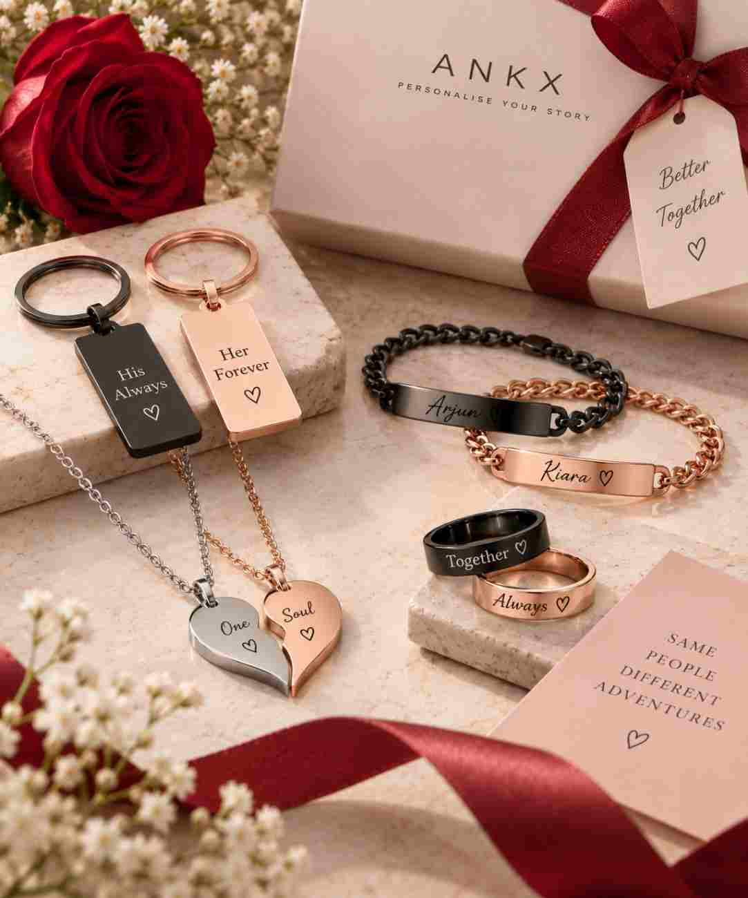 Couple gift collection featuring matching necklaces, bracelets, rings and keychains arranged on a premium cream background with elegant gift packaging.