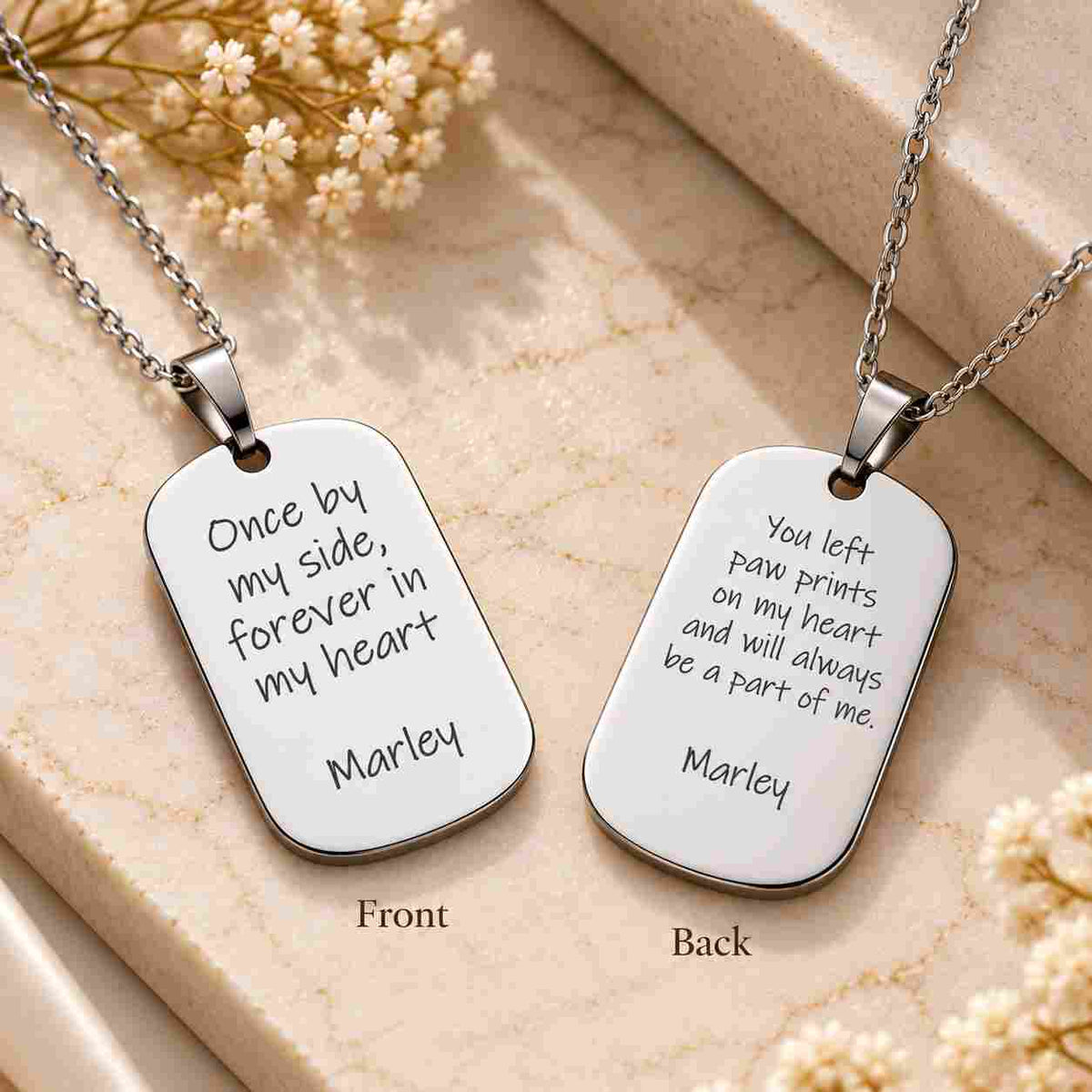 Silver personalized dog tag necklaces showing front and back engraving, featuring a memorial message and custom name “Marley.”