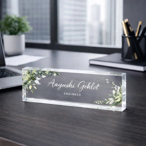 Personalized acrylic desk nameplate with custom name and designation on a professional office desk