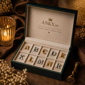 Alphabet letter pins displayed in an open ANKX.in branded gift box