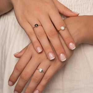 Custom Alphabet Ring with multiple initials worn on hand close-up.