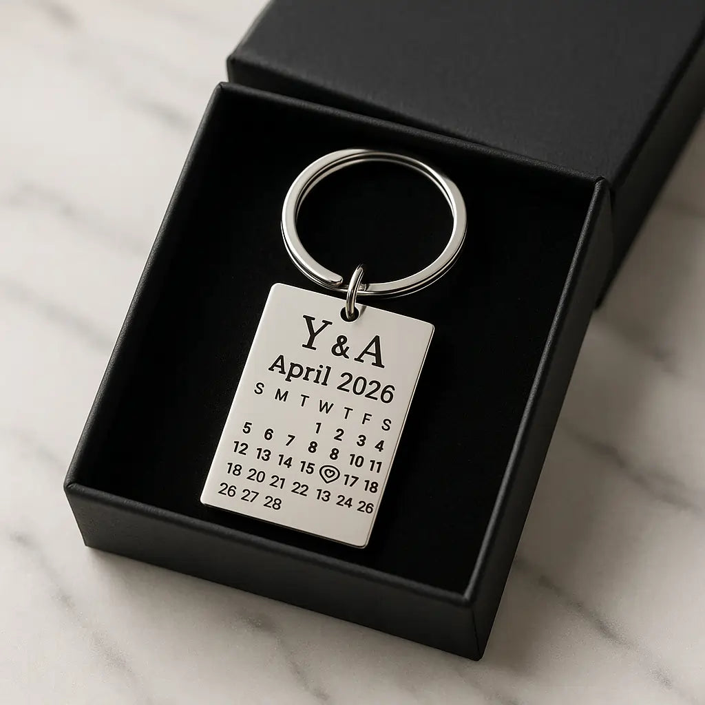 Custom date keychain with engraved calendar placed inside a black gift box