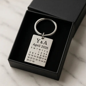 Custom date keychain with engraved calendar placed inside a black gift box