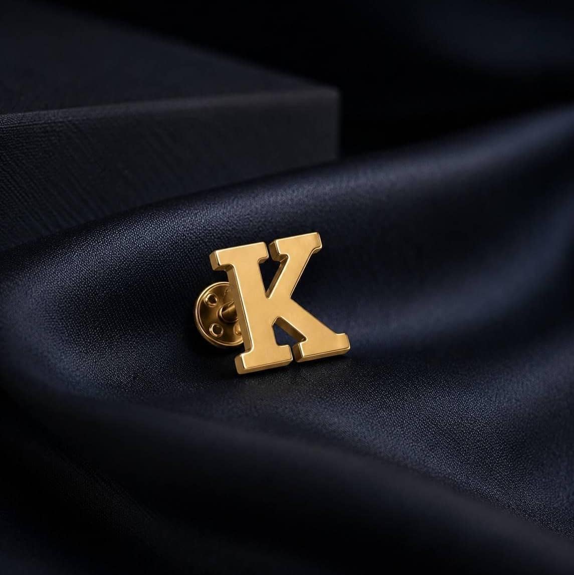 Gold Alphabet Brooch in the shape of the letter K, perfect for personalized accessories  