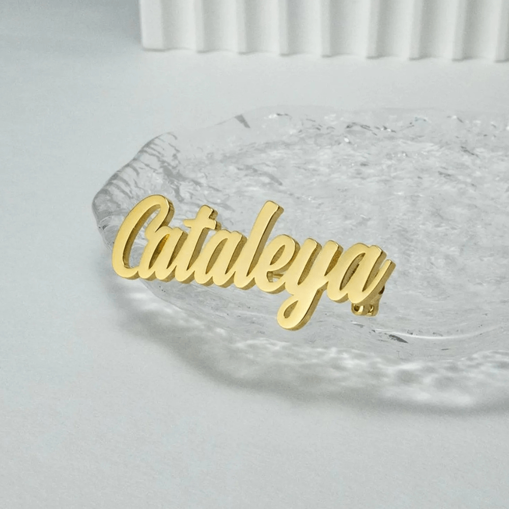 Personalized name lapel pin in gold showcasing elegant cursive design for unique style