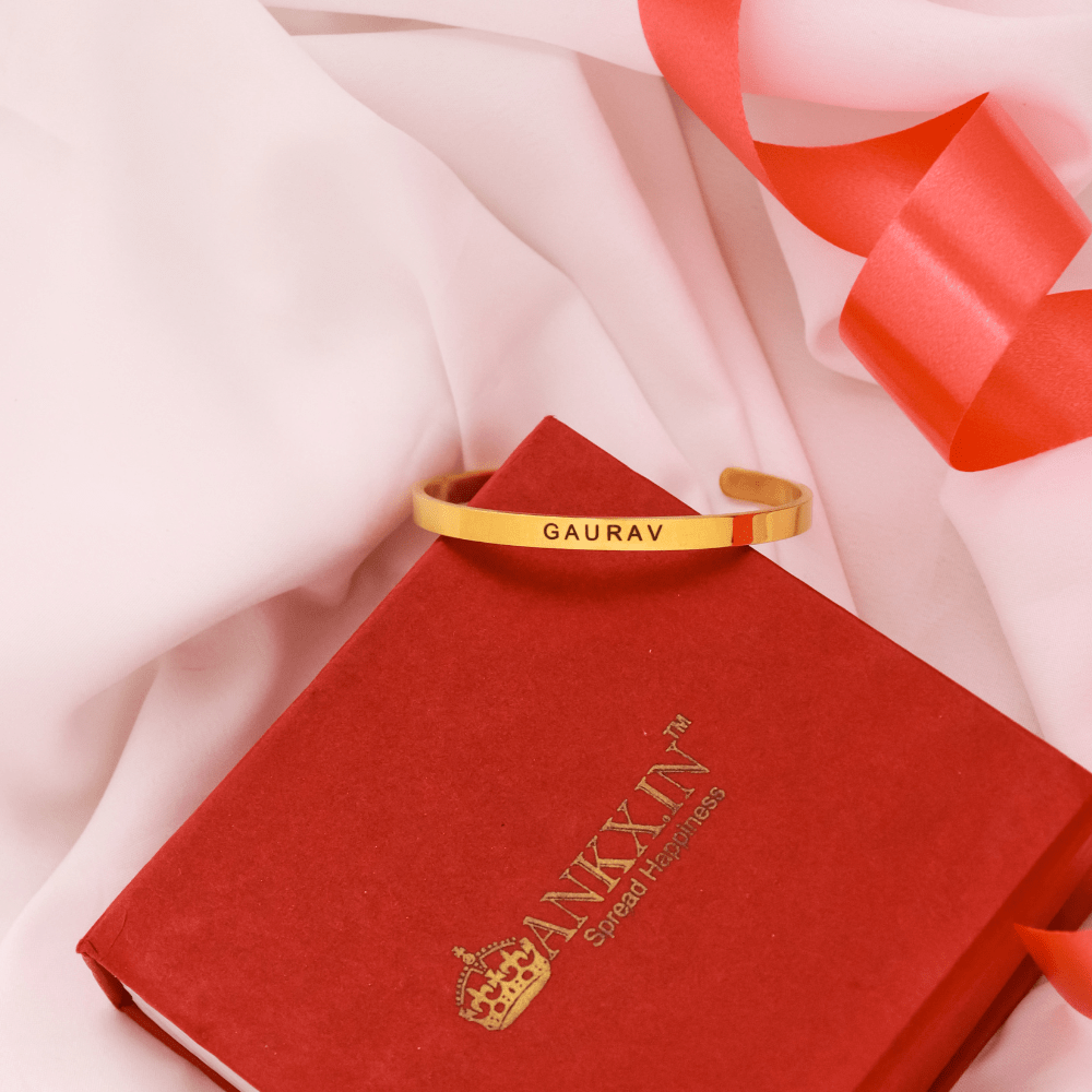 Gold tone Name Bracelet with custom engraving GAURAV on red Ankx.in gift box